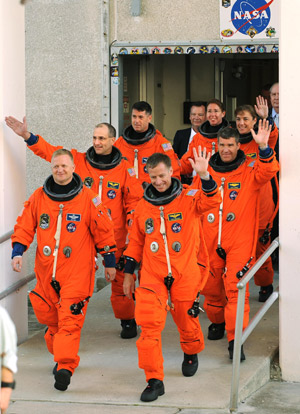 Space shuttle Endeavour crew leave the Operations and Checkout Building to prepare for their launch at Kennedy Space Center in Cape Canaveral, Fla., Friday, Nov. 14, 2008.