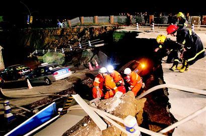 At least one person is dead and 18 are missing after a road caved in on a subway tunnel under construction in the eastern Chinese city of Hangzhou on Saturday, rescuers said.