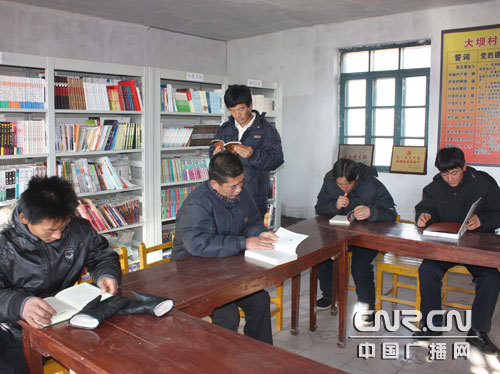 Farmers read books in the reading room in Daba Village, Woniu Town of north China’s Inner Mongolia Autonomous region on November 13, 2008. The Ministry of Culture will invest 800 million yuan (US$117 million) this year improving cultural facilities in rural areas where some 800 million people live.
