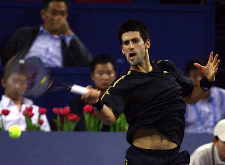 Serbia's Novak Djokovic plays a forehand against Russia's Nikolay Davydenko during the final of men's singles at Tennis Masters Cup Shanghai, 2008, in Shanghai, Nov. 16, 2008. Novak Djokovic won the title by defeating Davydenko 6-1, 7-5. [Xinhua]