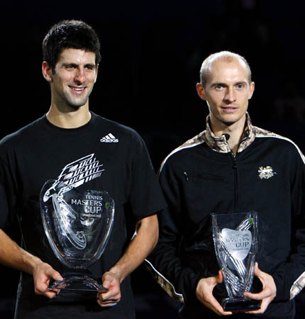 Serbia's Novak Djokovic (L) and Russia's Nikolay Davydenko pose with their trophies during the awarding ceremony for the final of men's singles at Tennis Masters Cup Shanghai, 2008, in Shanghai, Nov. 16, 2008. Novak Djokovic won the title by defeating Russia's Nikolay Davydenko 6-1, 7-5. [Xinhua]