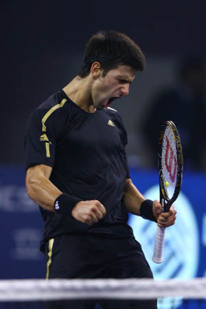 Serbia's Novak Djokovic jubilates after scoring against Russia's Nikolay Davydenko during the final of men's singles at Tennis Masters Cup Shanghai, 2008, in Shanghai, Nov. 16, 2008. Novak Djokovic won the title by defeating Davydenko 6-1, 7-5. [Xinhua]