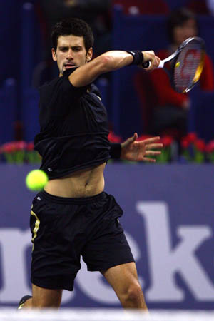 Serbia's Novak Djokovic returns the ball against Russia's Nikolay Davydenko during the final of men's singles at Tennis Masters Cup Shanghai, 2008, in Shanghai, Nov. 16, 2008. Novak Djokovic won the title by defeating Davydenko 6-1, 7-5. [Xinhua]