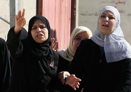 Relatives of Ahmed al-Hellou, a militant of Popular Resistance Committees (PRC), shout during a funeral in Gaza, on Nov. 16, 2008.