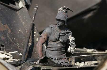 A burnt statue is seen amongst the wreckage at the Oakridge mobile home community, where hundreds of homes were destroyed Saturday during a wind-driven wildfire, in the Sylmar area of Los Angeles November 16, 2008.