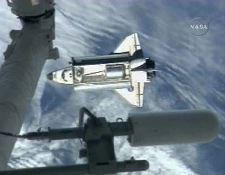 The U.S. space shuttle Endeavour arrives at the International Space Station and is ready to dock with it on Sunday.