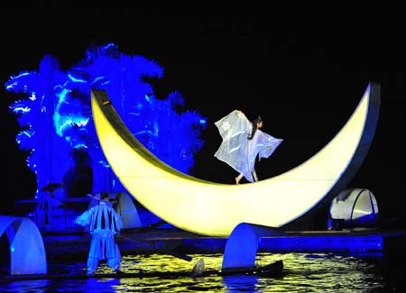 Performers sing and dance against the natural backdrop during the world's largest outdoor musical 'Impression: Sister Liu Sanjie' in Guilin, south China's Guangxi Zhuang Autonomous Region, Nov. 16, 2008. 