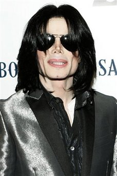 In this Nov. 8, 2007 file photo, pop star Michael Jackson poses on the red carpet during the RainbowPUSH Coalition Los Angeles 10th annual awards in Los Angeles.