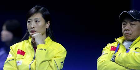 Newly-retired Olympic badminton champion Zhang Ning (L) and her former coach Tang Xuehua watch a game at the ongoing China Open Badminton event in Shanghai November 19, 2008. Zhang retained her singles title in the Beijing Olympics in August and now coaches the women's team. [Xinhua]