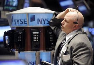 Trader works on the floor of the New York Stock Exchange Tuesday, Nov. 18, 2008. [Richard Drew/AP Photo] 