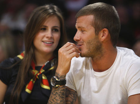 Soccer star David Beckham R chats with Francesca Leiweke daughter