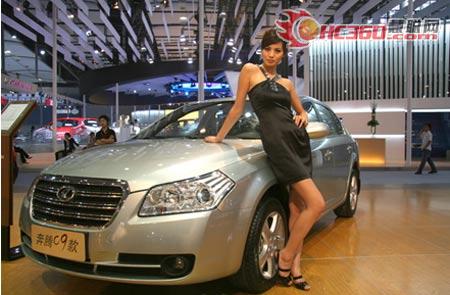 A model stands next to a car at the 6th Guangzhou International Automobile Exhibition in Guangzhou, South China's Guangdong Province, November 18, 2008.