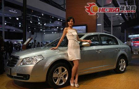 A model stands next to a car at the 6th Guangzhou International Automobile Exhibition in Guangzhou, South China's Guangdong Province, November 18, 2008.