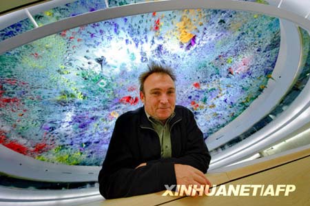 Spanish artist Miquel Barcelo stands under his ceiling painting on the dome of Room XX at the European headquarters of the United Nations in Geneva, Nov. 17. 