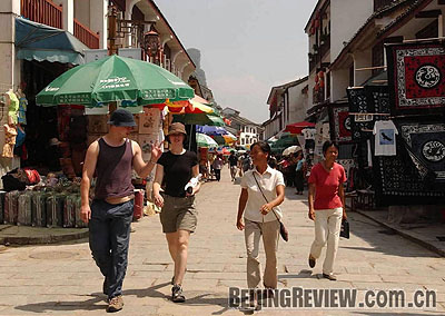 Bargaining with enthusiastic street merchants is all part of the experience of a trip to Yangshuo's popular Xijie commercial street.