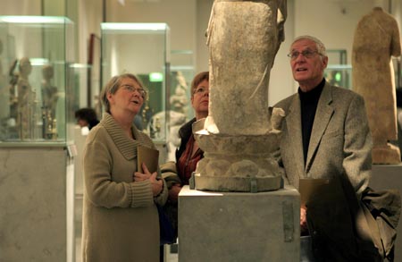 Visitors watch the items on display in Guimet Museum of Paris, France, Nov. 18, 2008.