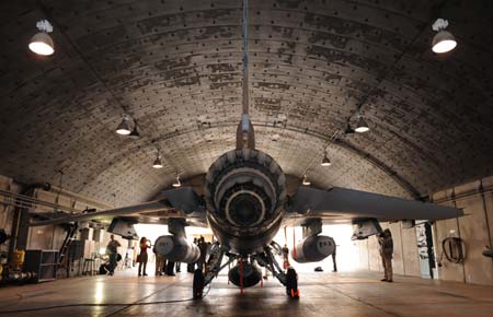 An F-16I fighter plane is seen in a hanger at Ramon Air Base in Negev, southern Israel, November 19, 2008. Israel on Wednesday displayed air power it could use to attack Iran's suspected nuclear weapons during an exhibition for journalists. (Xinhua/Yin Bogu) 