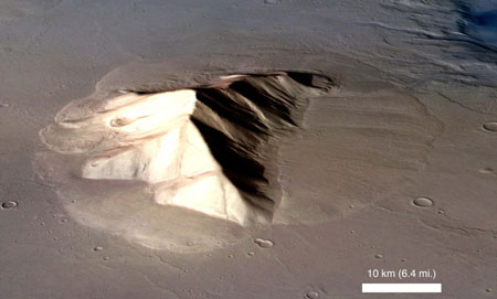 This handout image, released November 20, 2008, shows a perspective view of a mountain in the eastern Hellas region of Mars surrounded by a lobate deposit with flow textures on the surface. A radar instrument aboard a NASA spacecraft has detected large glaciers hidden under rocky debris that may be the vestiges of ice sheets that blanketed parts of Mars in a past ice age, scientists said on Thursday. 