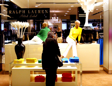 A shopper looks at goods by designer Ralph Lauren at a display in Bloomingdales department store in New York, November 19, 2008. U.S.