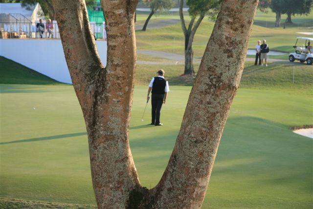 Former winner Colin Montgomerie finishes with a par on the last.