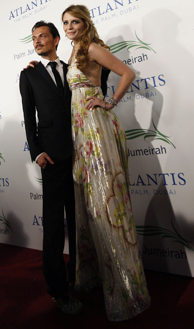 Actress Mischa Barton arrives with designer Matthew Williamson (L) for the grand opening of Atlantis, The Palm in Dubai November 20, 2008. The $1.5 billion mega resort with 1,539 rooms is the first resort to open on Dubai's Palm Jumeirah artificial island.