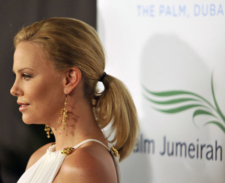 Actress Charlize Theron arrives for the grand opening of Atlantis, The Palm in Dubai November 20, 2008. The $1.5 billion mega resort with 1,539 rooms is the first resort to open on Dubai's Palm Jumeirah artificial island.