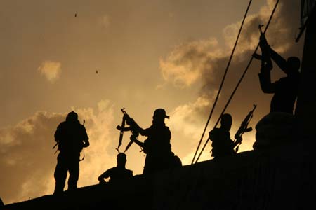 Palestinian militants of the Popular Resistance Committees (PRC) attend a graduation ceremony in Gaza city, Nov. 21, 2008. Ismail Haneya, leader of the Palestinian Hamas movement which controls Gaza Strip, said on Friday his movement is still committed to a June ceasefire with Israel in spite of recent surge of violence. 