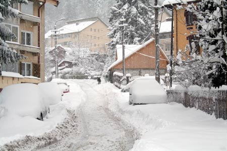 A street is covered by heavy snow in Predeal, Brasov County of Romania, Nov. 22, 2008. Romanian national weather bureau released snowstorm yellow alarm to 26 of the total 41 counties in the country since the first snow of the year falled on Nov. 21.