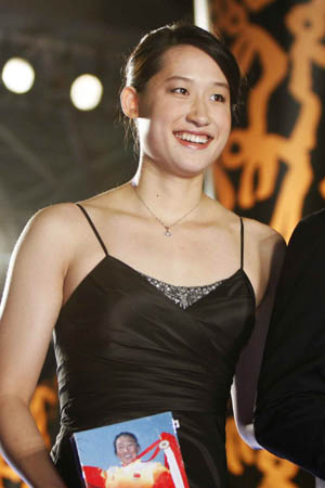 Liu Zige, Beijing Olympic swimming gold medalist, walks on the red carpet before the 2008 China Top Ten Benefiting Laureus Sports For Good award ceremony in Beijing, Nov.21, 2008. 