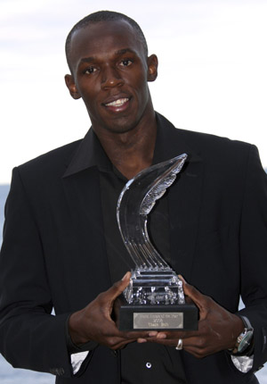 Usain Bolt of Jamaica displays his IAAF World Athlete of the Year trophy ahead of the annual global awards ceremony in Monaco November 23, 2008.