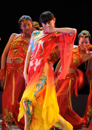 Performers perform on the stage during the 7th Zhejiang Music and Dance Festival in Hangzhou, capital of east China's Zhejiang Province, Nov. 24, 2008. More than 700 contestants will present 227 musical works, 80 percent of which are original, during the festival that kicked off on Monday.