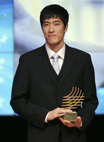 Liu Xiang of China holds his Performance of the Year Trophy for 2006 during the IAAF World Athletic Gala in Monte Carlo November 23, 2008. Liu Xiang received the award on Sunday as he was not able to attend the World Athletic Gala in 2006. 