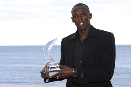 Usain Bolt of Jamaica displays his IAAF World Athlete of the Year trophy ahead of the annual global awards ceremony in Monaco November 23, 2008. 
