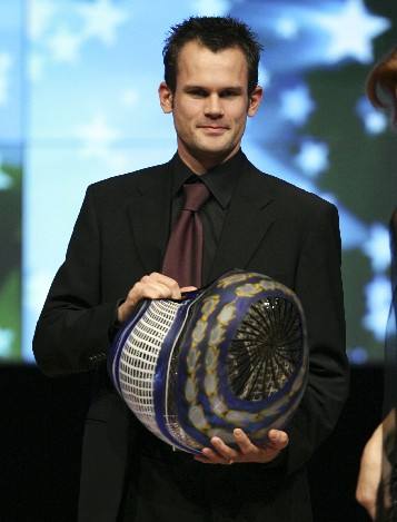 Stefan Holm of Sweden receives the Distinguished Career Award during the IAAF World Athletic Gala in Monte Carlo November 23, 2008. 
