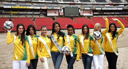 (L-R) Miss New Zealand Kahurangi Julia Taylor, Miss Egypt Sanaa Ismail Hamed, Miss Brazil Tamara Almeida Silva, Miss World Zilin Zhang of China, Miss South Africa Tansey Coetzee, Miss Italy Claudia Russo, Miss United States Mercia Lane Lindell and Miss Spain Patricia Yurena Rodriguez Alonjo pose at Ellis Park stadium as they represent their countries which will compete in the 2009 FIFA Confederation Cup in Johannesburg, November 20, 2008.