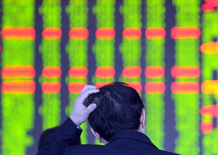 A Chinese investor sits in front of a stock price board at a stock exchange in Shenyang, capital of northeast China's Liaoning Province Nov. 24, 2008. Chinese shares dropped on Monday as the benchmark Shanghai Composite Index lost 3.67 percent to close at 1,897.06. The Shenzhen index dropped 3.65 percent to close at 6,466.19 points. [Xinhua]