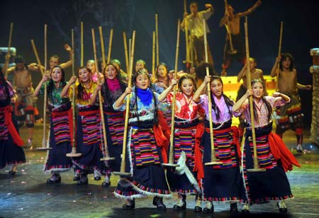 Dancers perform in the musical 'Tibetan Riddle' in Beijing, capital of China, Nov. 26, 2008. The musical 'Tibetan Riddle', presenting the original Tibetan culture with folk dances and songs, was put on in Beijing again on Wednesday after being improved. [Xinhua]