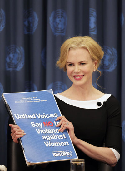 Goodwill Ambassador and actress Nicole Kidman presents a book full of signatures supporting the goal of United Nations Development Fund for Women (UNIFEM) to bring attention to violence against women during a news conference at the United Nations Headquarters in New York on November 25, 2008. 