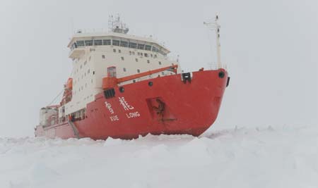 China's ice breaker Xuelong or 'Snow Dragon' is blocked by thick ice around the Antarctica during her 25th expedition to Antarctica, on Nov. 24, 2008. An ice detection team was formed on Tuesday to search for new routes due to the thick and condensed ice that stopped the ice breaker.