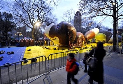 Workers prepare Beethoven, the St. Bernard dog balloon for the Macy's Thanksgiving Day parade, Wednesday, Nov. 26, 2008 in New York. The parade will be celebrating its 82nd year Nov. 27, 2008. 