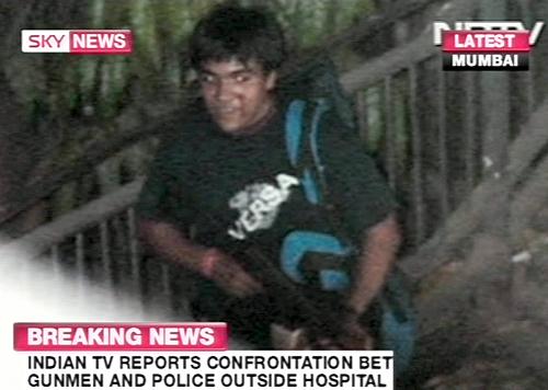 TV grab from Indian TV via Sky News shows an armed man suspected to be one of the assailants, according to Sky News, after a series of attacks in Mumbai on November 26, 2008, with police reporting firing incidents and explosions at different sites across India's financial capital.