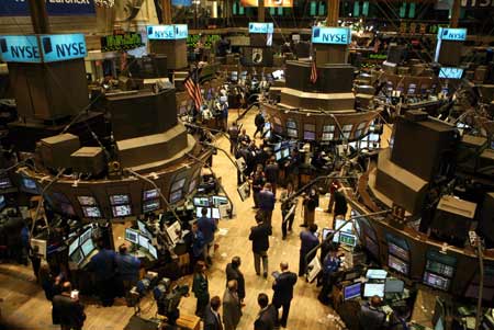 Traders work on the floor of the New York Stock Exchange, Nov. 24, 2008. 