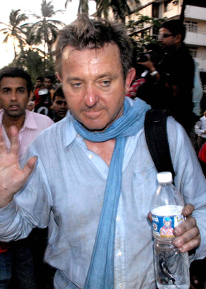 Darus Sarboski from Polland walks out from Hotel Oberoi after being hostage for more than 16 hours, in Mumbai, India, Nov. 27, 2008. All hostages at Taj Hotel have been rescued, but there could still be some people trapped at Trident Hotel and Nariman House where operations were on to flush out militants, Maharashtra police chief A N Roy said Thursday. 