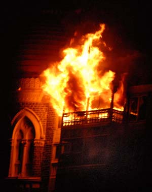 A fire breaks out of the dome of the Taj hotel in Mumbai, India, Nov. 27, 2008. All hostages at Taj Hotel have been rescued, but there could still be some people trapped at Trident Hotel and Nariman House where operations were on to flush out militants, Maharashtra police chief A N Roy said Thursday. 