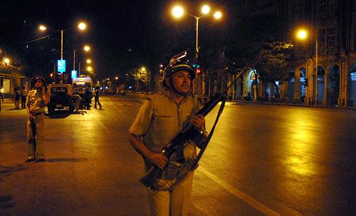 Indian commandos take positions outside the Oberoi in Mumbai, India, Nov. 27, 2008. 