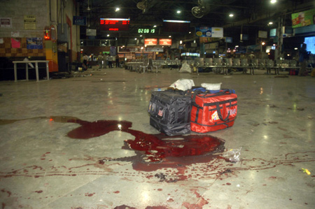 Luggages are seen near a pool of blood after shootings by unidentified assailants at a railway station in Mumbai November 26, 2008.