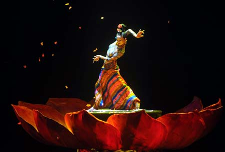 Yang Liping, a well-known Chinese dancer, performs in the musical 'Tibetan Riddle' in Beijing, capital of China, Nov. 26, 2007. The musical 'Tibetan Riddle', presenting the original Tibetan culture with folk dances and songs, was put on in Beijing again on Wednesday after being improved.(Xinhua)