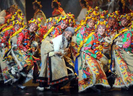 Dancers perform in the musical 'Tibetan Riddle' in Beijing, capital of China, Nov. 26, 2007. The musical 'Tibetan Riddle', presenting the original Tibetan culture with folk dances and songs, was put on in Beijing again on Wednesday after being improved. (Xinhua)