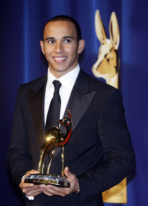 Formula one driver Lewis Hamilton poses with the trophy during the 60th Bambi media awards ceremony in the southwestern German town of Offenburg Nov. 27, 2008. Each year, the German media company 'Hubert Burda Media,' honours celebrities from the world of entertainment, literature, sports and politics with the Bambi awards. [Xinhua/Reuters]