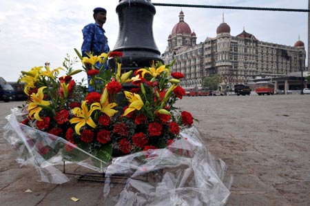 Flowers are placed in front of the Taj Mahal Hotel to commemorate the victims in the terror attacks in Mumbai, India, Nov. 30, 2008. India's longest terror nightmare that lasted for almost 59 hours ended Saturday. Mumbai disaster authorities put the death toll to 195 and the injured 295, but the toll is rising as more bodies were collected from the attacked places.[Xinhua]